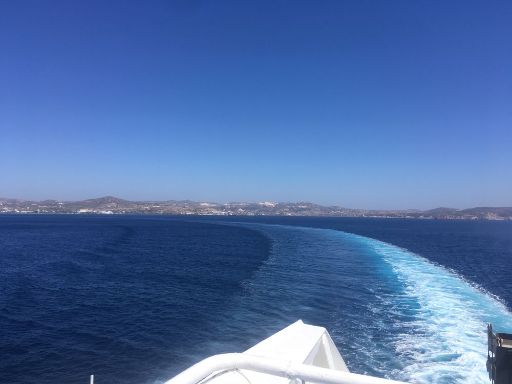 ferry leaving a Greek island