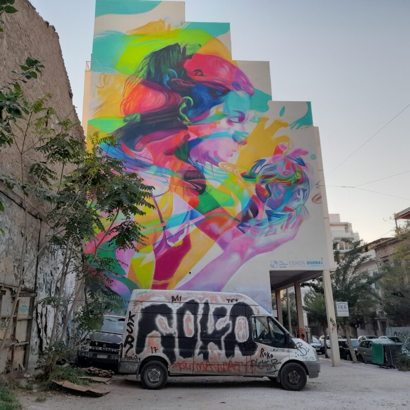 large colorful street art mural in Metaxourghio