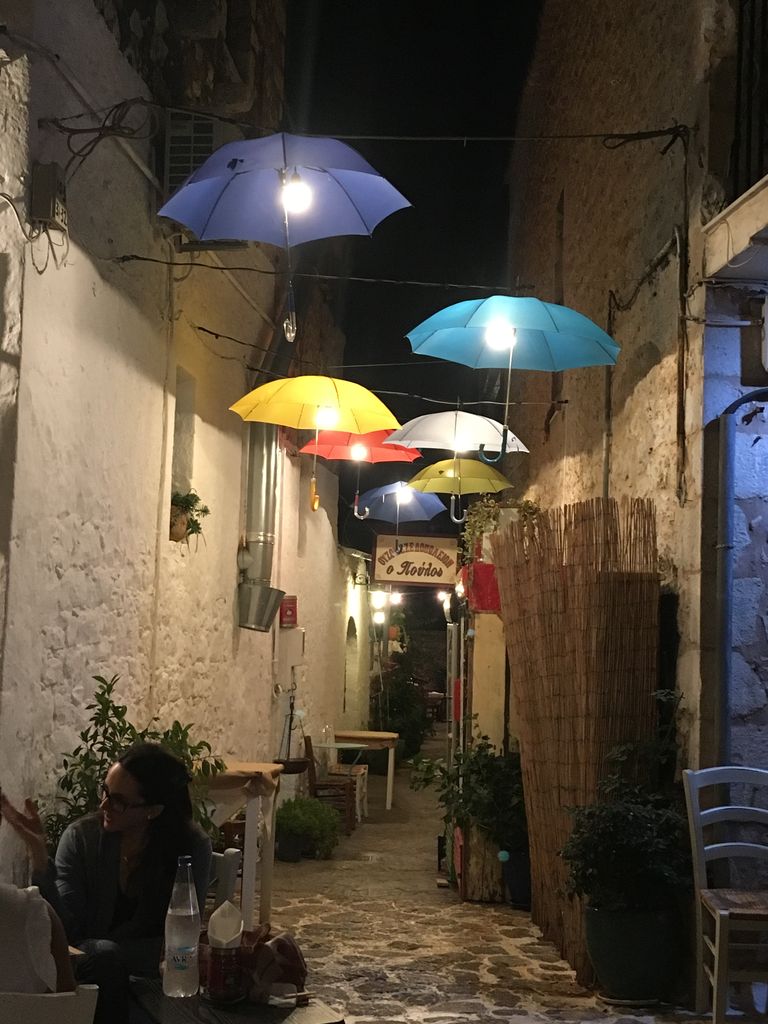 alley with umbrellas to reach the taverna o poulos in Areopoli