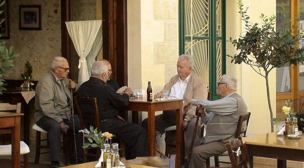 Greek men at the terrace of a café
