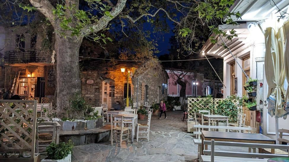 Rahes or Raches, village square filled with cafe and tavern terraces, tables and chairs
